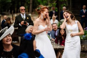 same sex couple at a wilderness wood wedding