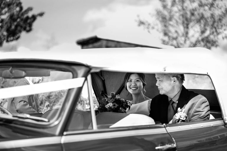 a bride with her father at her wedding