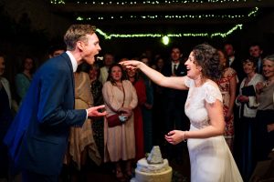 A bride feeding cake to her groom at a Higher Eggbeer Farm wedding